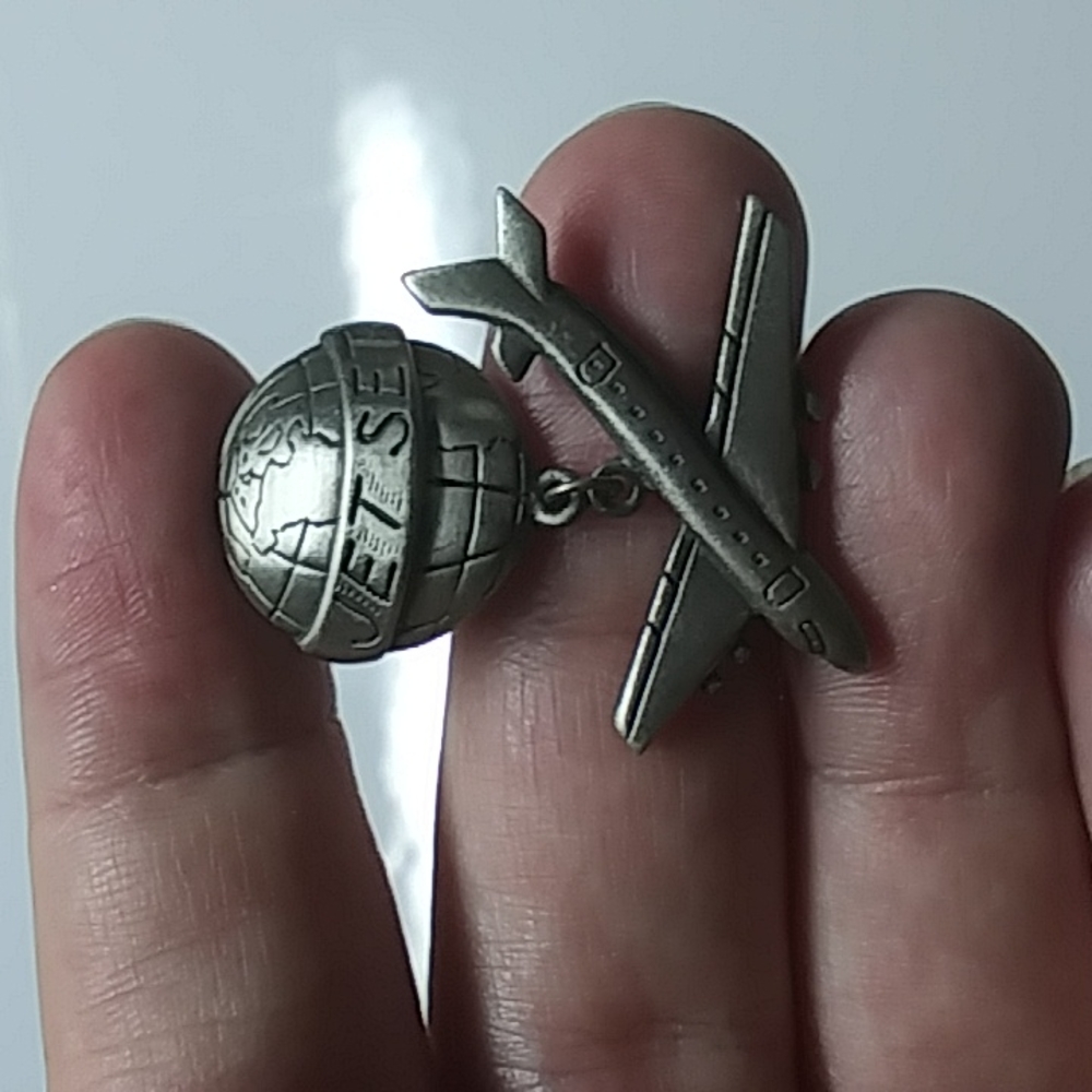 Silver toned jet set pin